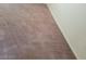 Close up on neutral colored bedroom carpeting and the base of a white wall at 7290 Sheared Cliff Ln # 102, Las Vegas, NV 89149