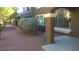 Townhouse exterior with manicured landscaping and decorative stone accents at 7290 Sheared Cliff Ln # 102, Las Vegas, NV 89149