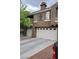 Townhouse exterior features garages and upper balconies at 7290 Sheared Cliff Ln # 102, Las Vegas, NV 89149