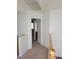 Second-floor hallway with carpeted floors and neutral paint at 7290 Sheared Cliff Ln # 102, Las Vegas, NV 89149