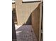 A narrow patio with a brick floor leads to the front door at 7290 Sheared Cliff Ln # 102, Las Vegas, NV 89149