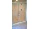 Shower with glass doors and chrome fixtures at 7290 Sheared Cliff Ln # 102, Las Vegas, NV 89149
