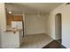 Open dining room with tile floors, ceiling fan, and adjacent to kitchen with breakfast bar at 75 N Valle Verde Dr # 2121, Henderson, NV 89074