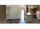 Open-concept living room with a fireplace, connected to the kitchen with white appliances at 75 N Valle Verde Dr # 2121, Henderson, NV 89074