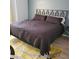 Cozy bedroom with modern headboard, plush pillows, and stylish accent rug at 7745 Fruit Dove St, North Las Vegas, NV 89084
