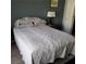 Bedroom with a neutral color scheme and a comfortable bed at 7745 Fruit Dove St, North Las Vegas, NV 89084