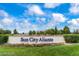 Sun City Aliante community entrance sign, framed by lush landscaping and blue skies at 7745 Fruit Dove St, North Las Vegas, NV 89084