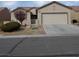 Charming single-story home features a well-maintained front yard and attached two-car garage at 7745 Fruit Dove St, North Las Vegas, NV 89084