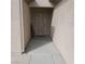 Close-up of the home's entryway featuring a secure, barred door at 7745 Fruit Dove St, North Las Vegas, NV 89084