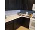 Functional kitchen showcasing dark cabinets and ample counter space at 7745 Fruit Dove St, North Las Vegas, NV 89084
