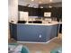 Well-lit kitchen featuring dark cabinetry and ample countertop space at 7745 Fruit Dove St, North Las Vegas, NV 89084