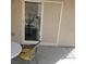 Outdoor patio with sliding glass door, privacy screen and a seating area at 7745 Fruit Dove St, North Las Vegas, NV 89084