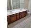 Bathroom vanity featuring double sinks and cabinetry, tile flooring at 8324 W Charleston Blvd # 2033, Las Vegas, NV 89117