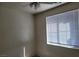 Bright bedroom with a ceiling fan and a large window at 8324 W Charleston Blvd # 2033, Las Vegas, NV 89117