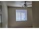 Bright bedroom with a ceiling fan and a large window providing ample natural light at 8324 W Charleston Blvd # 2033, Las Vegas, NV 89117