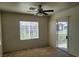 Bedroom with a ceiling fan, window, sliding glass door with access to balcony at 8324 W Charleston Blvd # 2033, Las Vegas, NV 89117