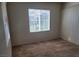Bedroom with a sliding glass door and large window providing abundant natural light at 8324 W Charleston Blvd # 2033, Las Vegas, NV 89117