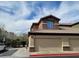 Condominium garages with stone accents and access to upper level apartments at 8324 W Charleston Blvd # 2033, Las Vegas, NV 89117