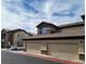Condominium garages with stone accents and access to upper level apartments at 8324 W Charleston Blvd # 2033, Las Vegas, NV 89117