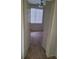 View into a bedroom from hallway showing natural light, window and carpet at 8324 W Charleston Blvd # 2033, Las Vegas, NV 89117