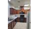 Well-equipped kitchen featuring stone countertops and modern appliances at 8324 W Charleston Blvd # 2033, Las Vegas, NV 89117