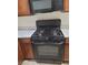 Close-up of the gas range with stone countertops at 8324 W Charleston Blvd # 2033, Las Vegas, NV 89117