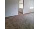Neutral carpeted living room with natural light from multiple windows with blinds at 8324 W Charleston Blvd # 2033, Las Vegas, NV 89117