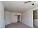 Spacious living room featuring neutral walls, ceiling fan, and adjacent dining area at 8324 W Charleston Blvd # 2033, Las Vegas, NV 89117