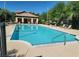 Community pool with lounge chairs, surrounded by well-maintained landscaping at 8324 W Charleston Blvd # 2033, Las Vegas, NV 89117