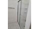 Bathroom walk-in shower with tiled walls and glass door at 8324 W Charleston Blvd # 2033, Las Vegas, NV 89117