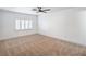 Spacious bedroom features neutral carpet, ceiling fan, and plantation shutters at 8469 Sewards Bluff Ave, Las Vegas, NV 89129