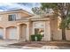 Charming two-story home with tile roof, desert landscaping, and attached one car garage at 8469 Sewards Bluff Ave, Las Vegas, NV 89129