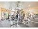 Community fitness center equipped with modern weight machines, mirrors, and ceiling fans at 8469 Sewards Bluff Ave, Las Vegas, NV 89129