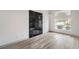 Bright living room featuring hardwood floors, fireplace, and view of the street at 8469 Sewards Bluff Ave, Las Vegas, NV 89129