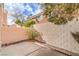 Enclosed patio surrounded by mature trees and block wall for privacy and shade at 8469 Sewards Bluff Ave, Las Vegas, NV 89129