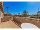 Balcony view of a residential street, neighborhood homes, and lush foliage at 8809 Barium Rock Ave, Las Vegas, NV 89143