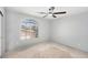 Bedroom is enhanced by a modern ceiling fan and a large window that offers natural light at 8809 Barium Rock Ave, Las Vegas, NV 89143
