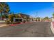 Ironwood community entrance sign with a two-story building visible in the background on a clear day at 8809 Barium Rock Ave, Las Vegas, NV 89143