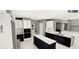 Stylish kitchen features white cabinets, dark countertops, and modern appliances at 8809 Barium Rock Ave, Las Vegas, NV 89143