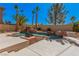 Inviting pool featuring a rock waterfall and lush landscaping at 8809 Barium Rock Ave, Las Vegas, NV 89143