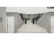 Entryway showcasing the dramatic, open staircase with black railings at 8809 Barium Rock Ave, Las Vegas, NV 89143