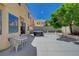 Backyard featuring a patio, outdoor seating, hot tub, and lush landscaping, providing a serene and inviting atmosphere at 9012 Old River Ave, Las Vegas, NV 89149