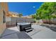 Relaxing backyard featuring a luxurious hot tub, a beautiful tree, and a well-maintained patio area at 9012 Old River Ave, Las Vegas, NV 89149