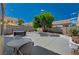 Spacious backyard with patio furniture, a hot tub, and a landscaped garden, perfect for outdoor living and entertaining at 9012 Old River Ave, Las Vegas, NV 89149