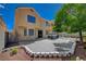 Large backyard with a patio area, hot tub, and beautifully landscaped garden, ideal for relaxation and outdoor activities at 9012 Old River Ave, Las Vegas, NV 89149