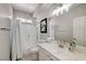 Bright bathroom featuring a tub-shower combo, vanity with sink, and neutral decor at 9012 Old River Ave, Las Vegas, NV 89149