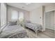 Bedroom with luxury vinyl plank flooring and two twin sized beds at 9012 Old River Ave, Las Vegas, NV 89149