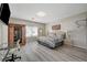 Bright primary bedroom with sauna, bed, work station and natural light at 9012 Old River Ave, Las Vegas, NV 89149