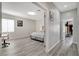 Bedroom with luxury vinyl plank flooring and a queen sized bed with a closet at 9012 Old River Ave, Las Vegas, NV 89149