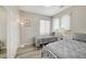 Bedroom with luxury vinyl plank flooring and two twin sized beds at 9012 Old River Ave, Las Vegas, NV 89149